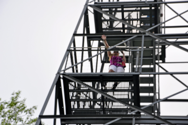 Karen Duquette climbing the Aiton Heights Fire Tower